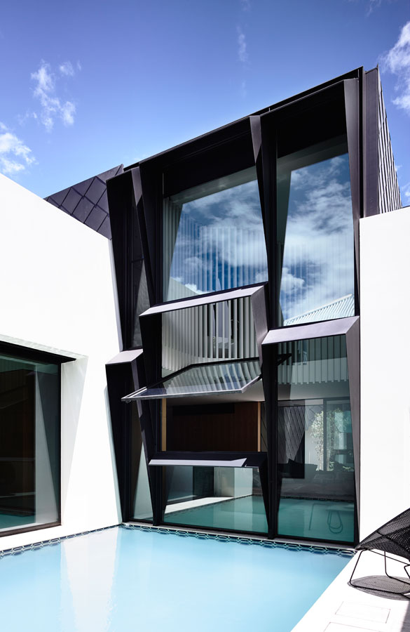 Overend Constructions, St Kilda West House, Kennedy Nolan, hinged window wall, pool view, angled black steel window reveals